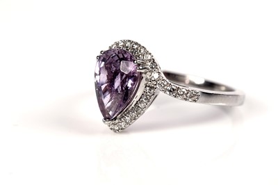 Lot 1290 - Lorique: a pink zoisite and diamond ring