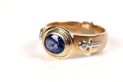 Lot 1291 - A sapphire and diamond ring