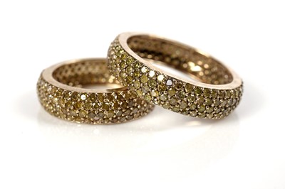 Lot 1292 - Two yellow-diamond eternity rings