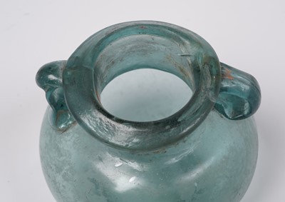 Lot 654 - A Roman blue glass urn