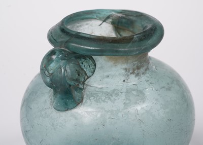 Lot 654 - A Roman blue glass urn