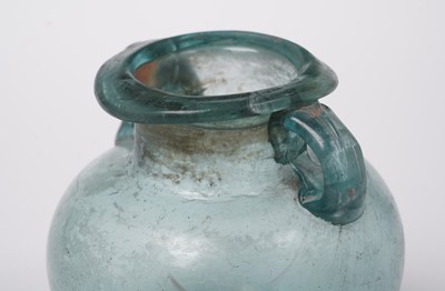 Lot 654 - A Roman blue glass urn