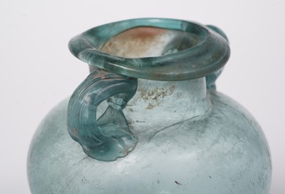 Lot 654 - A Roman blue glass urn