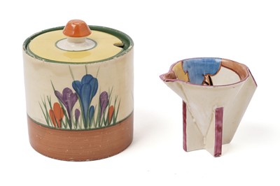 Lot 508 - A Clarice Cliff 'Blue Autumn' pattern cream jug; and a crocus pattern preserve jar and cover