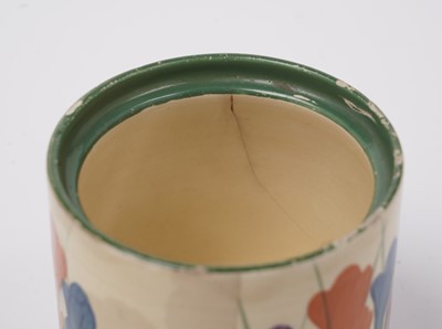 Lot 508 - A Clarice Cliff 'Blue Autumn' pattern cream jug; and a crocus pattern preserve jar and cover