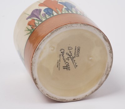Lot 508 - A Clarice Cliff 'Blue Autumn' pattern cream jug; and a crocus pattern preserve jar and cover