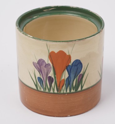 Lot 508 - A Clarice Cliff 'Blue Autumn' pattern cream jug; and a crocus pattern preserve jar and cover