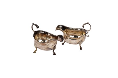 Lot 1554 - A pair of George III silver sauce boats