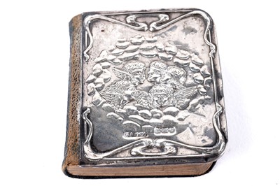 Lot 327 - An Edwardian silver covered miniature prayer book