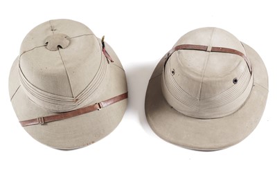 Lot 468 - Two pith helmets; in a hat box