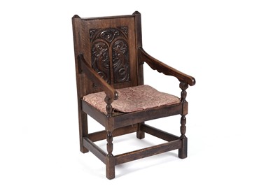 Lot 725 - A Welsh Gothic Revival carved oak armchair