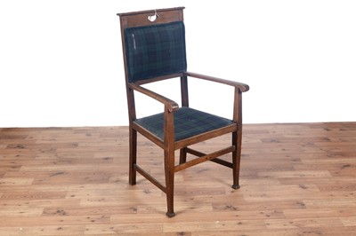 Lot 13 - Shoolbred and Co. Tottenham: an early 20th Century oak Arts and Crafts armchair