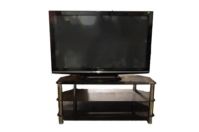 Lot 19 - A Panasonic 50inch television and remote with modern television stand