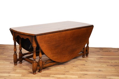 Lot 46 - Titchmarsh and Goodwin: a large oak drop leaf table