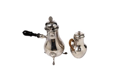 Lot 1398 - A late 19th Century French silver coffee pot; and milk jug