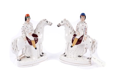 Lot 156 - A pair of 19th Century Staffordshire figures of jockeys