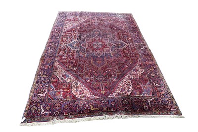 Lot 1211 - A Persian hand-made Heriz carpet