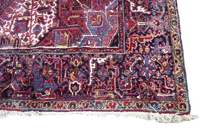 Lot 1211 - A Persian hand-made Heriz carpet