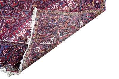 Lot 1211 - A Persian hand-made Heriz carpet