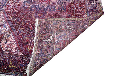 Lot 1211 - A Persian hand-made Heriz carpet