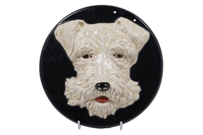 Lot 640 - A Clarice Cliff relief moulded wall plaque of a terrier