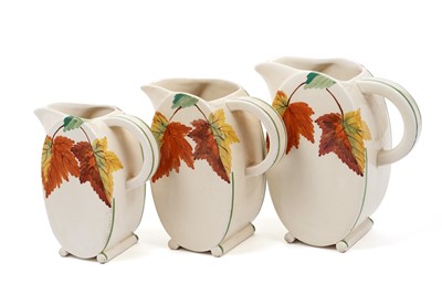 Lot 521 - A Royal Staffordshire A.J Wilkinson ‘Honeyglaze’ pattern set of three graduated jugs