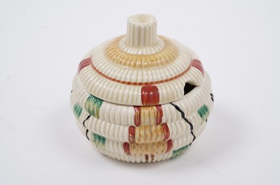 Lot 522 - A Clarice Cliff ‘Raffia Indiana’ pattern sugar bowl and lid