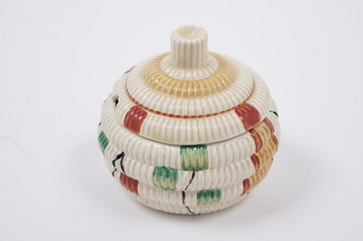 Lot 522 - A Clarice Cliff ‘Raffia Indiana’ pattern sugar bowl and lid