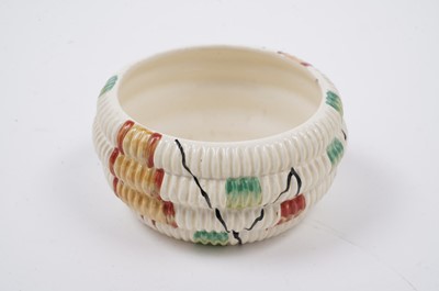 Lot 522 - A Clarice Cliff ‘Raffia Indiana’ pattern sugar bowl and lid