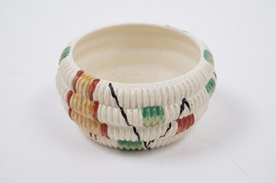 Lot 522 - A Clarice Cliff ‘Raffia Indiana’ pattern sugar bowl and lid