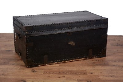 Lot 80 - An early 20th Century leather and metal bound steamer trunk