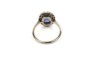 Lot 594 - A sapphire and diamond cluster ring