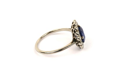 Lot 594 - A sapphire and diamond cluster ring