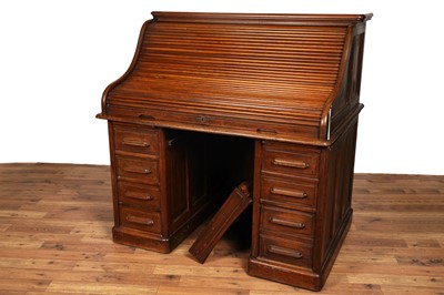 Lot 43 - An early 20th Century oak roll-top pedestal desk