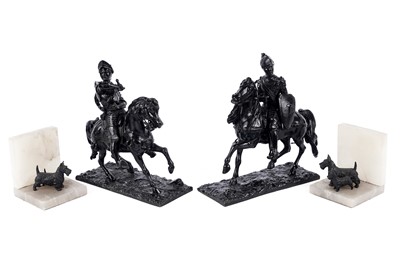 Lot 208 - A pair of onyx bookends; and a pair of decorative cast metal figures