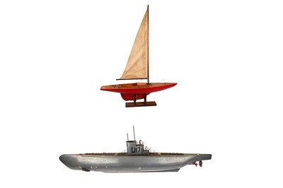 Lot 650 - A 20th Century model pond yacht; and a scratch-built model of a submarine