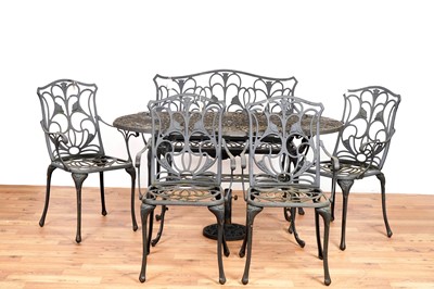 Lot 51 - A vintage black painted wrought metal garden table, bench, and chairs