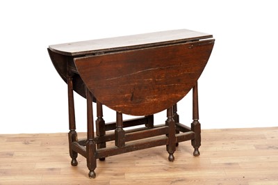 Lot 50 - A late 19th Century/ early 20th Century oak Pembroke table