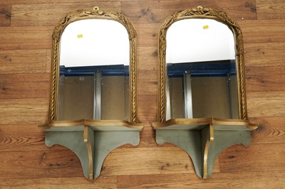 Lot 94 - A pair of ornate gilt painted mirrors