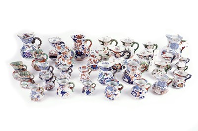 Lot 232 - A collection of late 19th Century and later ceramic jugs