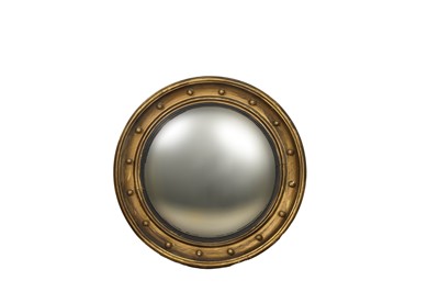 Lot 213 - A Regency style giltwood and gesso convex mirror