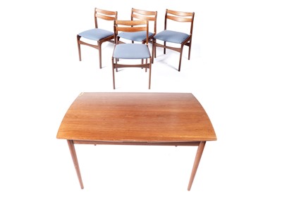 Lot 1 - A mid-20th Century teak extending dining table and four dining chairs