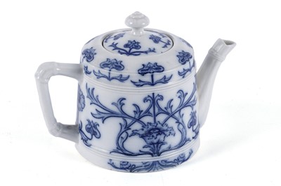 Lot 392 - A Macintyre Burslem tea pot with ornate blue floral decoration