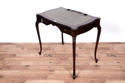 Lot 7 - An Edwardian style serpentine fronted writing desk