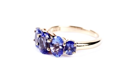 Lot 42 - A tanzanite five stone dress ring