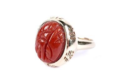 Lot 48 - A carved sardonyx dress ring