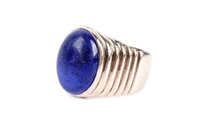 Lot 51 - A lapis lazuli cabochon dress ring