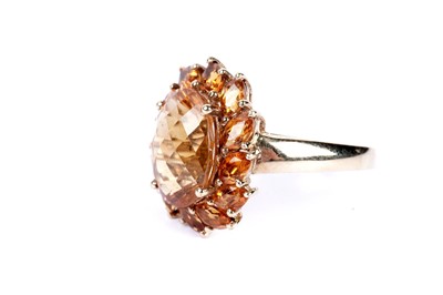 Lot 55 - A citrine flower cluster dress ring