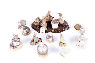 Lot 306 - A collection of Beatrix Potter ceramic figures and collectibles