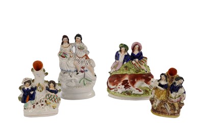 Lot 349 - A collection of 19th Century Staffordshire flatback figure groups and spill vases